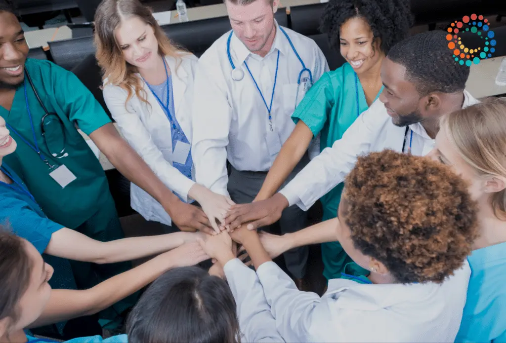 Group of diverse health care workers high fiving